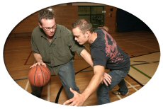 Two guys playing basketball