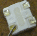 LED with wire held in place by flux