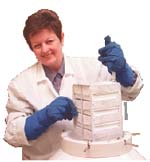 Arlene Flis taking samples from a cryofreezer.