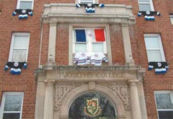 Hockey jerseys hang from the windows of St. Joseph's College in tribute to a former resident who vanished 15 years ago. Dean Mortensen failed to return to the residence after an evening out with friends and was never seen again.