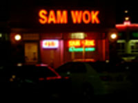 Late-night neon lights outside Sam Wok at 1am.